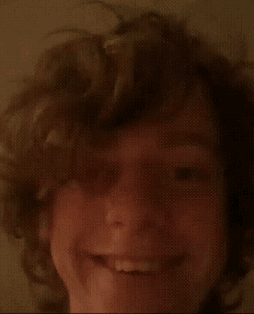 a close up of a person 's face with their eyes wide open