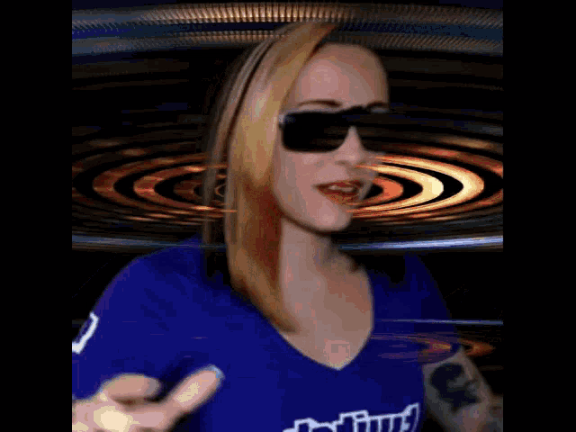 a woman in a dating shirt is wearing sunglasses