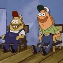 a couple of cartoon characters are sitting on a bench on a wooden deck .