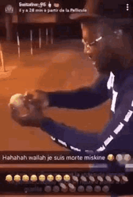 a man is holding a candle in his hand and it is glowing .