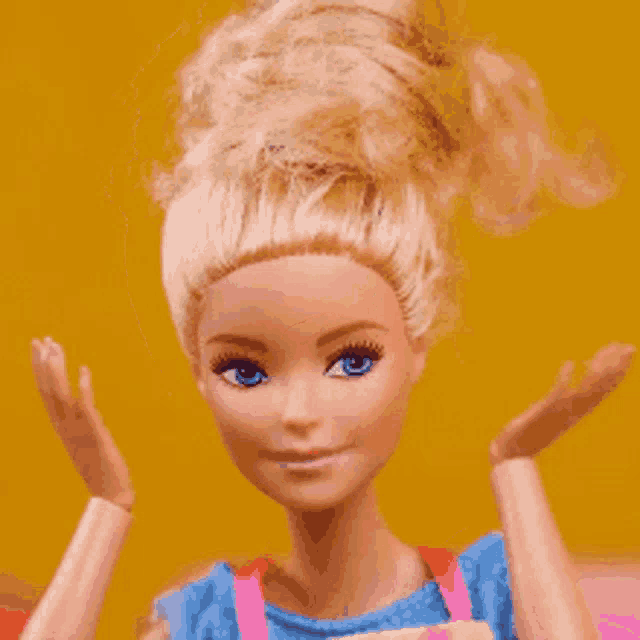 a close up of a barbie doll with blonde hair and blue eyes .