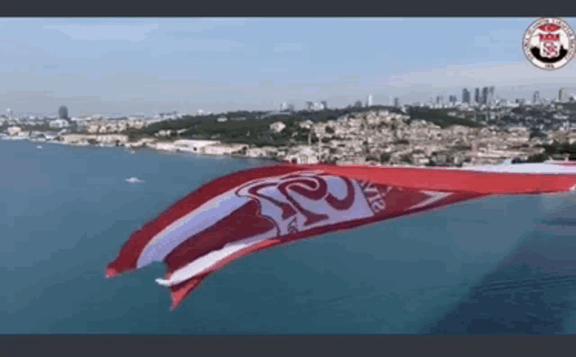 a large red and white flag with the word istanbul on it