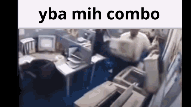 a blurry picture of a man sitting at a desk in an office with the words yba mih combo above him .