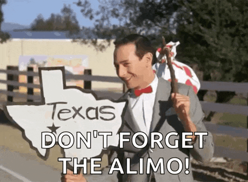 a man in a suit and bow tie is holding a sign that says texas don 't forget the alimo