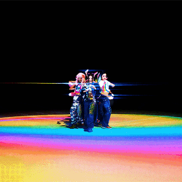 a group of women are posing for a photo with one wearing a shirt that says ' i love you ' on the side