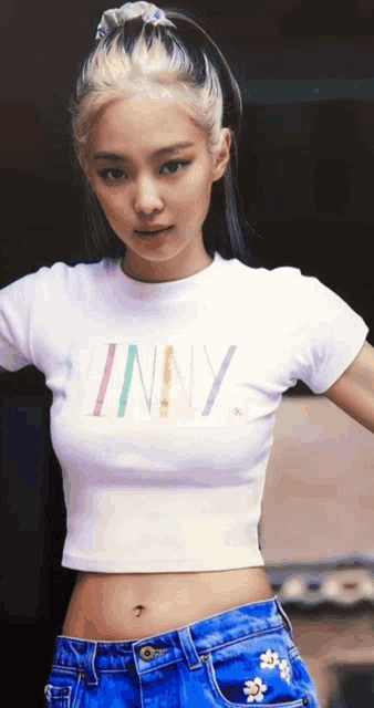 a woman wearing a white t-shirt that says skinny