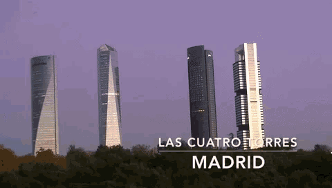 a row of tall buildings with the words las cuatro torres madrid on the bottom