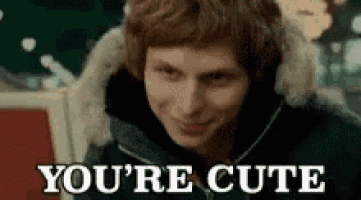 a man is smiling and says `` you 're cute '' .
