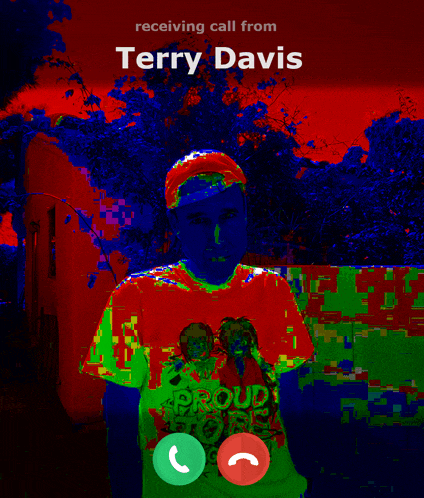 a man is receiving a call from terry davis who is wearing a proud roots shirt