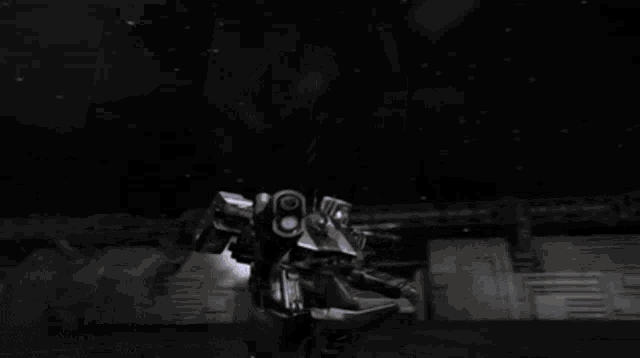 a black and white image of a robot with a purple light coming out of it 's mouth