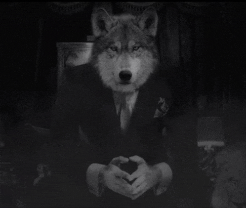 a black and white photo of a wolf wearing a suit