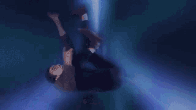 a man is falling through the air in a blurry cartoon .