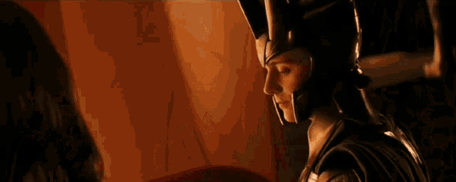 a woman in a helmet is looking at something