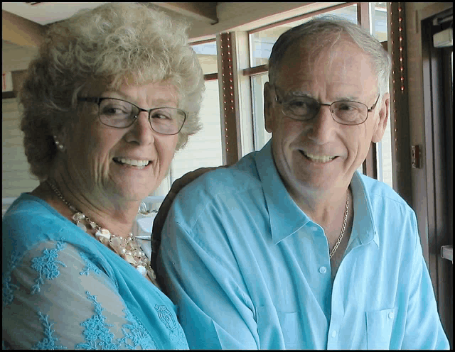 a man and a woman are posing for a picture together