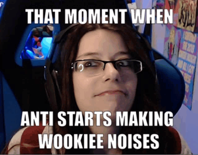 a woman wearing glasses and headphones with the caption that moment when anti starts making woookiee noises