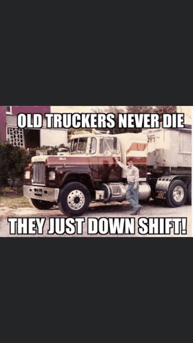 a man standing in front of an old truck with the caption old truckers never die they just down shift