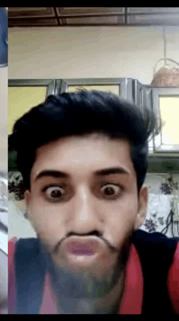 a man with a beard makes a funny face with his mouth open