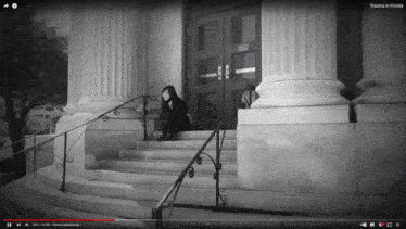 a black and white photo of a woman sitting on the steps of a building with trauma in florida written on the bottom