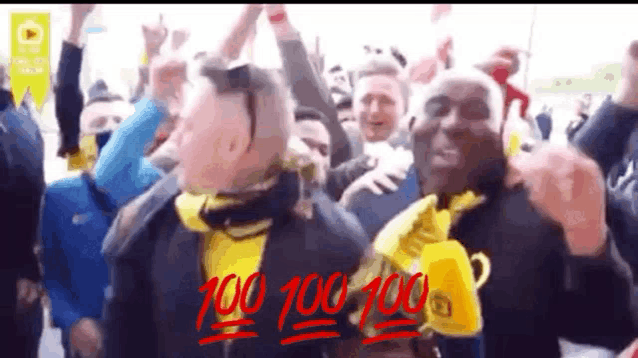 a group of people are celebrating with their arms in the air and the words 100 100 100 are written in red .