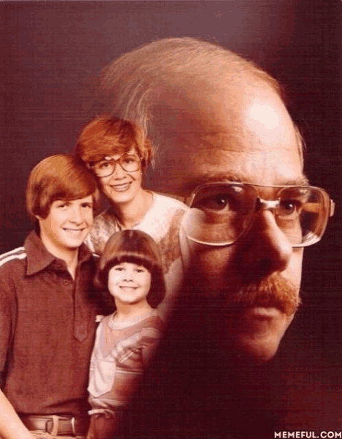 a man with glasses and a mustache is surrounded by his family