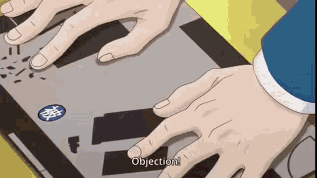 a person is typing on a laptop and the word objection is visible on the screen