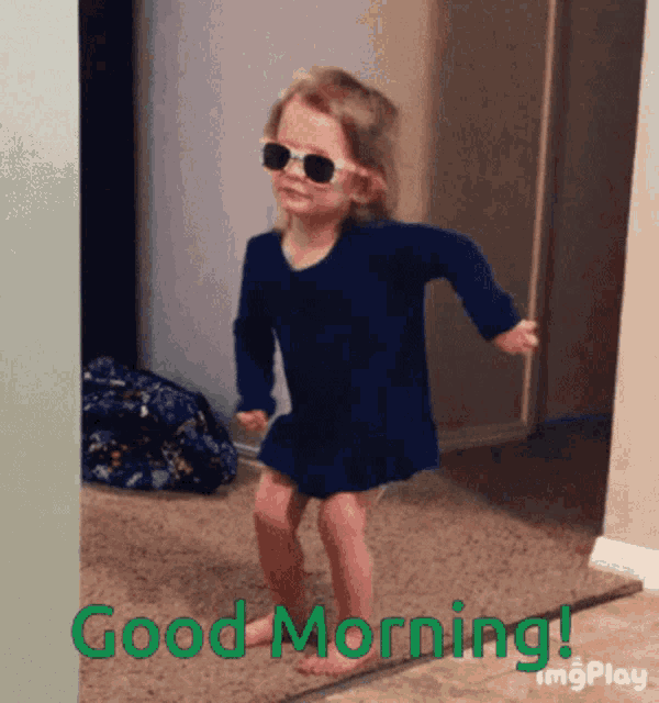a little girl wearing sunglasses and a blue dress is dancing with the words " good morning " behind her