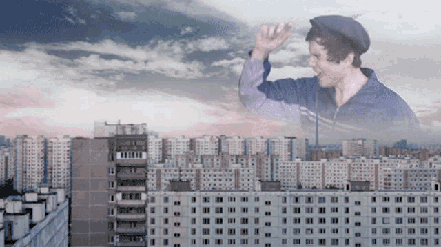 a man in a hat stands in front of a city