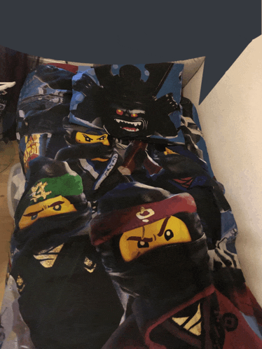 a bed with a ninjago bedding set