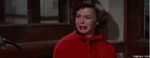 a woman in a red coat is sitting on a bench and says `` i don 't know ... '' .