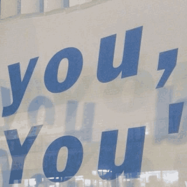 a blue sign that says you 're you ' on it