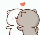 a couple of cats kissing each other with a heart above them .