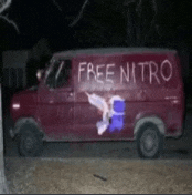 a red van that says free nitro on the side