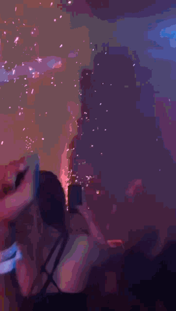 a blurry picture of a person holding a microphone