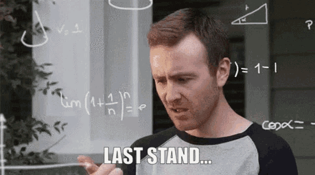 a man is standing in front of a chalkboard with mathematical equations on it and says " last stand "