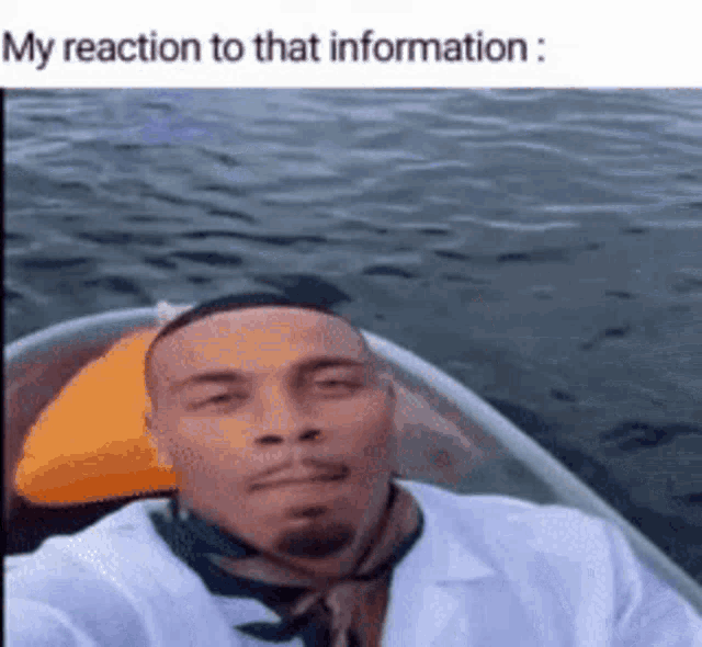 a man is taking a selfie in a boat in the water with the caption my reaction to that information