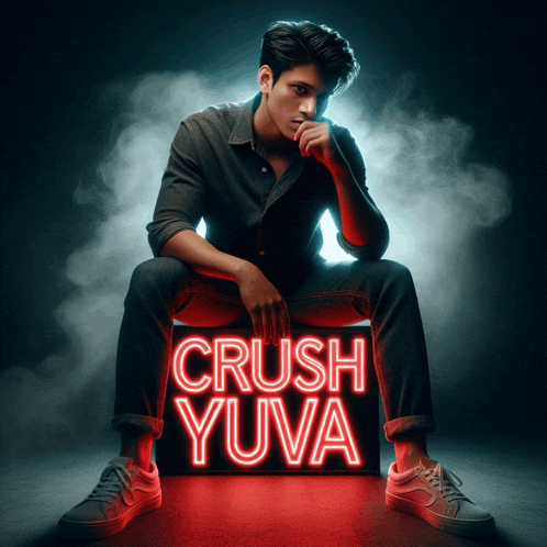 a man is sitting next to a sign that says crush yuva