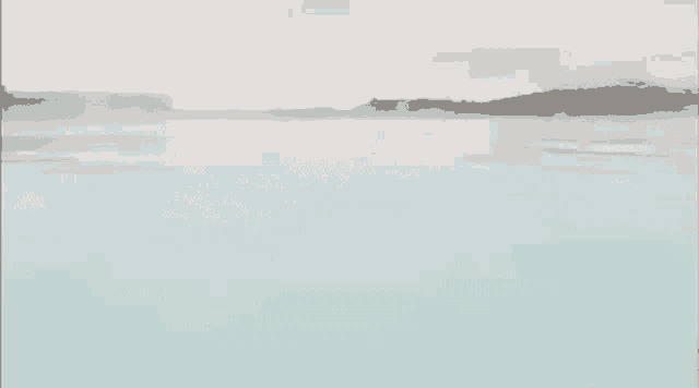 a painting of a lake with a foggy sky in the background