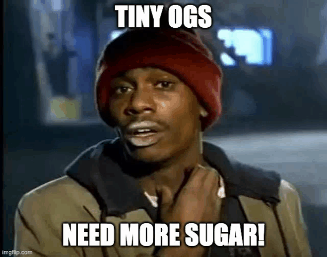 a man wearing a red hat is making a funny face and says `` tiny ogs need more sugar '' .