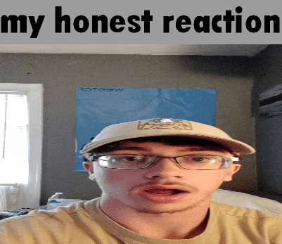 a man wearing glasses and a hat with the words " my honest reaction " behind him