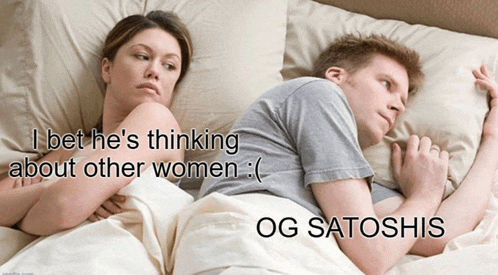 a man and a woman are laying in bed with a caption that says og satoshis