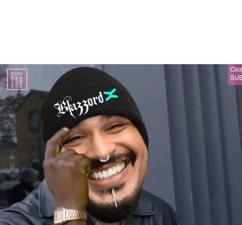 a man wearing a black beanie that says blizzard x on it