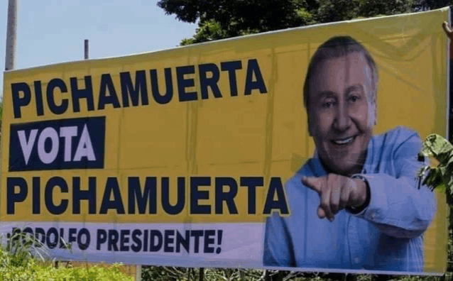 a billboard with a picture of a man and the words " vota pichamuerta "