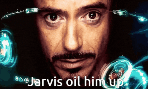 a close up of a man 's face with the words jarvis oil him up in the corner
