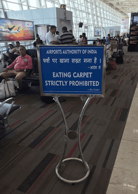 a sign that says eating carpet strictly prohibited