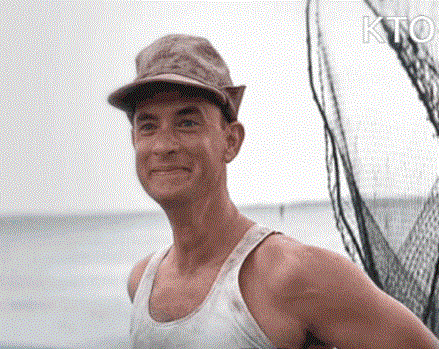 a man wearing a hat and a tank top is smiling in front of a net .