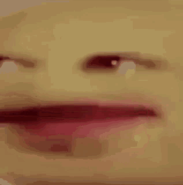 a close up of a person 's face with their mouth open and their eyes closed .