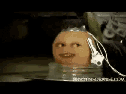 a bottle with a face on it is sitting next to a machine .