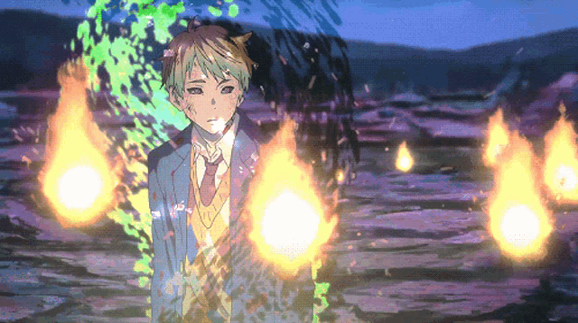 a boy in a suit and tie is surrounded by fire