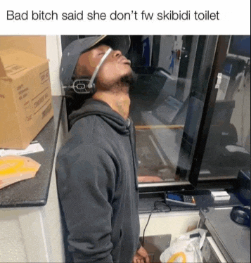 a man wearing a headset is leaning against a wall with the caption bad bitch said