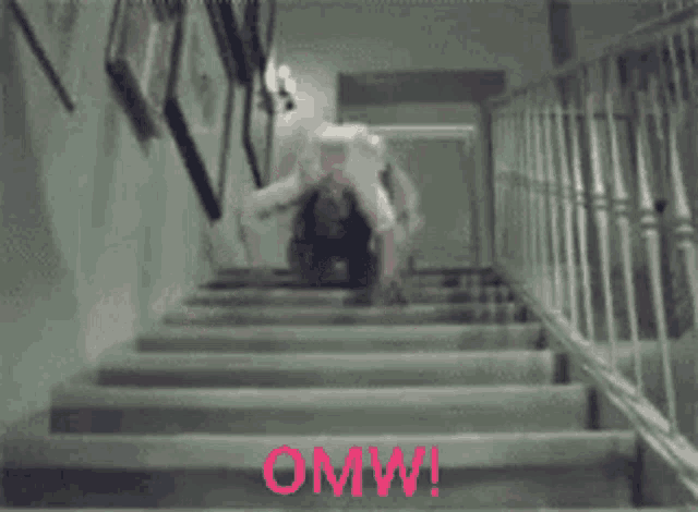 a person standing on a set of stairs with the words omw written in red